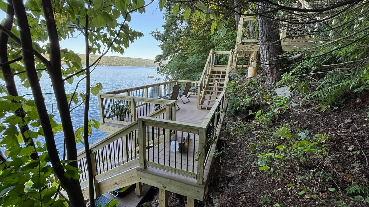 Multi-level hillside stair and deck access down to the waterfront